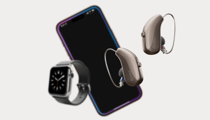 Widex: Two hearing aids with smartphone and watch